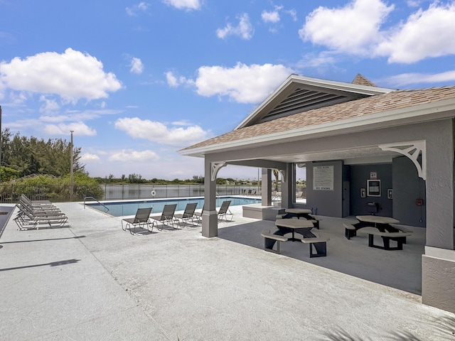 5900 S Golden Beauty Ln Unit 5900, Tamarac, FL 33321 - community pool featuring a patio