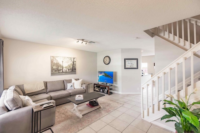 5900 S Golden Beauty Ln Unit 5900, Tamarac, FL 33321 - living area with light tile patterned floors, stairs, and a textured ceiling