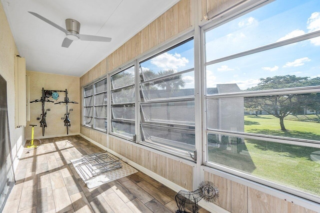 148 Lake Constance Dr Unit 148, West Palm Beach, FL 33411 - unfurnished sunroom featuring a ceiling fan, wood walls, and wood finished floors