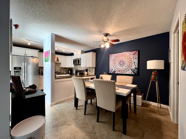 1535 Masters Cir Unit 148, Delray Beach, FL 33445 - dining area with a ceiling fan, a textured ceiling, and light tile patterned floors