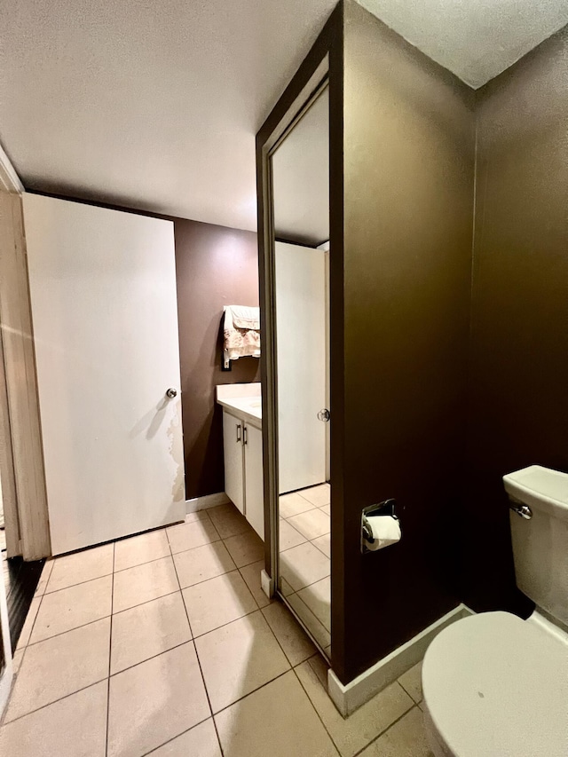 1535 Masters Cir Unit 148, Delray Beach, FL 33445 - bathroom featuring vanity, tile patterned floors, and a textured ceiling