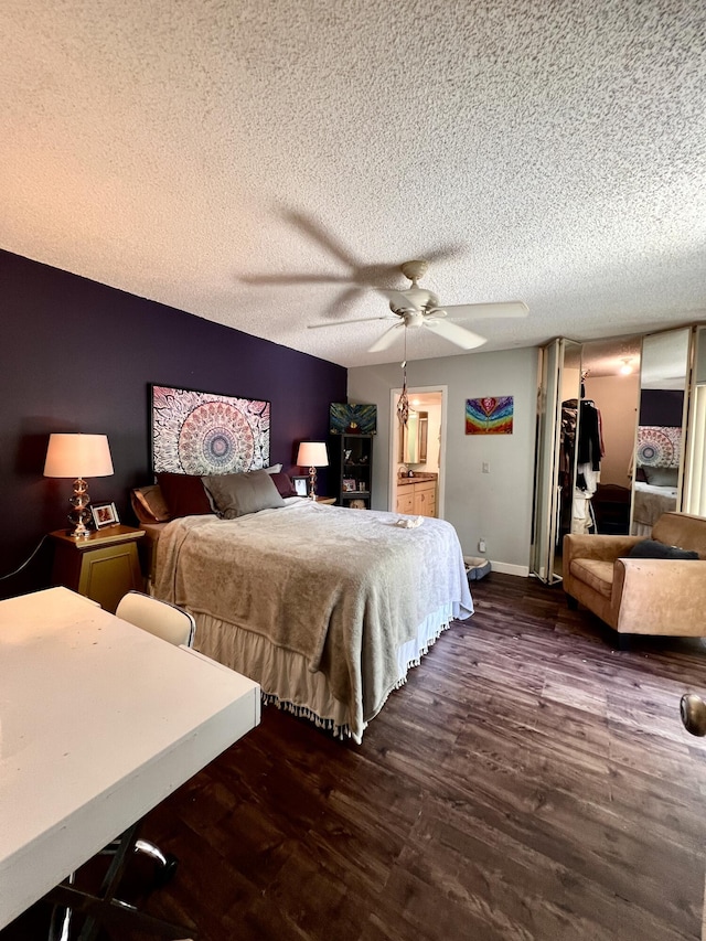 1535 Masters Cir Unit 148, Delray Beach, FL 33445 - bedroom featuring dark wood-type flooring, a textured ceiling, and ceiling fan
