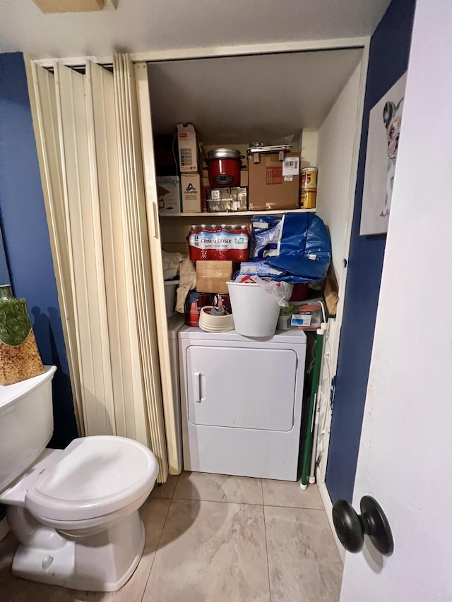 1535 Masters Cir Unit 148, Delray Beach, FL 33445 - washroom featuring washer / clothes dryer and tile patterned floors
