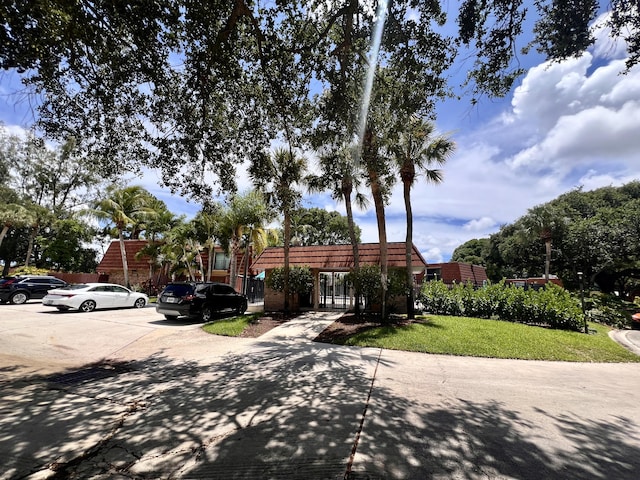 1535 Masters Cir Unit 148, Delray Beach, FL 33445 - view of front of property with uncovered parking