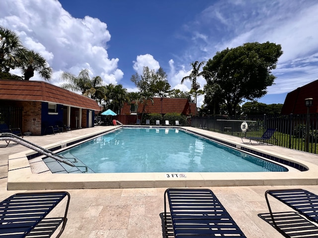 1535 Masters Cir Unit 148, Delray Beach, FL 33445 - community pool with a patio area