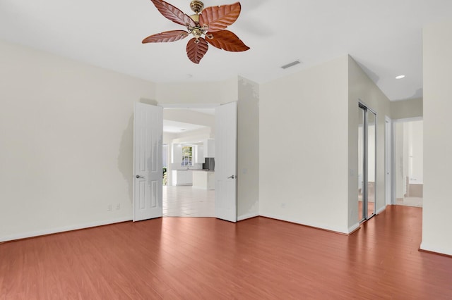8851 Oldham Way, Palm Beach Gardens, FL 33412 - unfurnished room with wood finished floors, ceiling fan, and recessed lighting