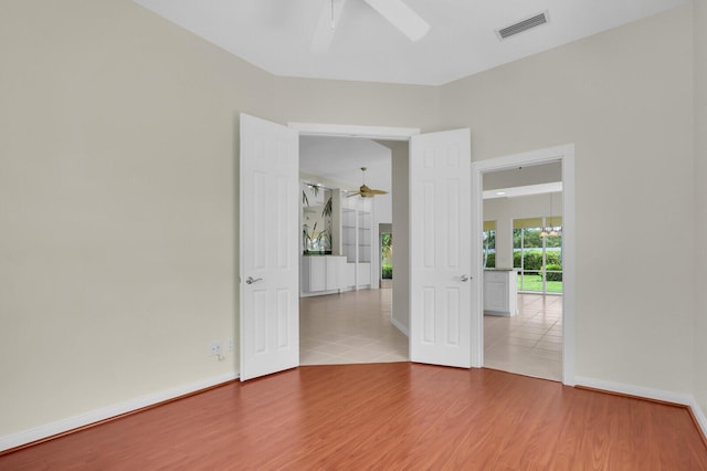 8851 Oldham Way, Palm Beach Gardens, FL 33412 - empty room featuring ceiling fan and wood finished floors