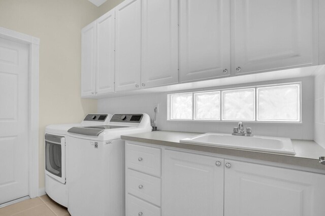 8851 Oldham Way, Palm Beach Gardens, FL 33412 - laundry room featuring cabinet space, independent washer and dryer, and light tile patterned floors