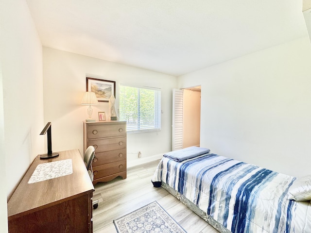 312 Knotty Pine Cir Unit C-1, Greenacres, FL 33463 - bedroom with light wood finished floors and baseboards