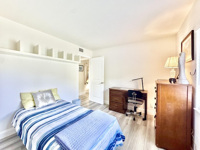 312 Knotty Pine Cir Unit C-1, Greenacres, FL 33463 - bedroom with light wood-style floors and baseboards