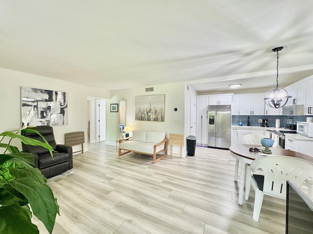 312 Knotty Pine Cir Unit C-1, Greenacres, FL 33463 - living area with light wood-type flooring
