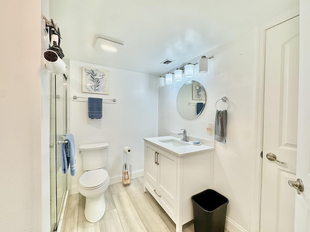 312 Knotty Pine Cir Unit C-1, Greenacres, FL 33463 - full bathroom featuring vanity, a shower with shower door, and wood finished floors