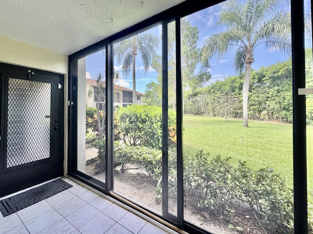 312 Knotty Pine Cir Unit C-1, Greenacres, FL 33463 - doorway with tile patterned flooring, floor to ceiling windows, and a textured ceiling