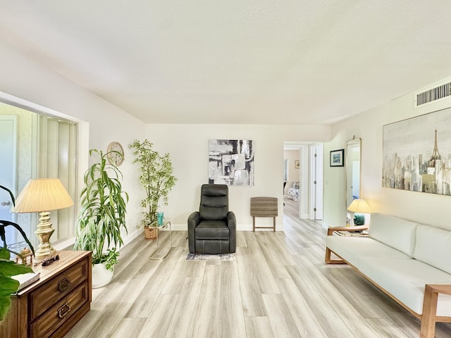 312 Knotty Pine Cir Unit C-1, Greenacres, FL 33463 - living room with light wood-style floors and baseboards