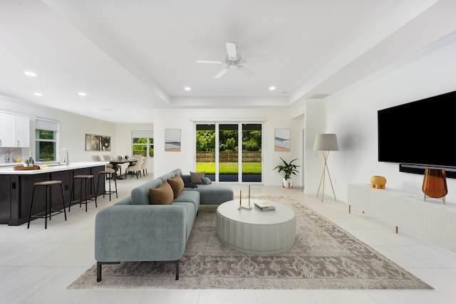 2571 SW Berry Park Cir, Palm City, FL 34990 - living room with ceiling fan, healthy amount of natural light, light tile patterned floors, recessed lighting, and a raised ceiling