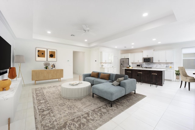 2571 SW Berry Park Cir, Palm City, FL 34990 - living room with a raised ceiling, light tile patterned flooring, recessed lighting, and ceiling fan