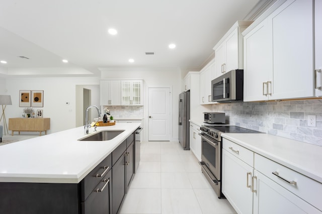 2571 SW Berry Park Cir, Palm City, FL 34990 - kitchen with stainless steel appliances, white cabinetry, light countertops, decorative backsplash, and glass insert cabinets