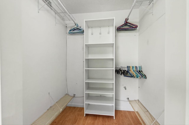 16 Willowbrook Ln Unit 102, Delray Beach, FL 33446 - spacious closet featuring wood finished floors