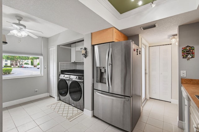 16 Willowbrook Ln Unit 102, Delray Beach, FL 33446 - kitchen with stainless steel fridge with ice dispenser, washer and clothes dryer, a ceiling fan, light tile patterned flooring, and decorative backsplash