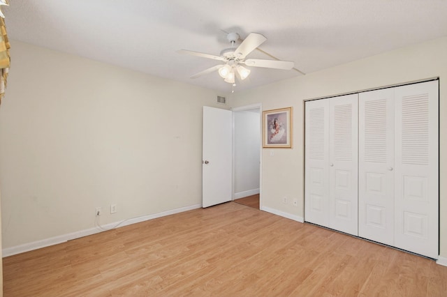 16 Willowbrook Ln Unit 102, Delray Beach, FL 33446 - unfurnished bedroom with light wood-type flooring, a closet, and ceiling fan