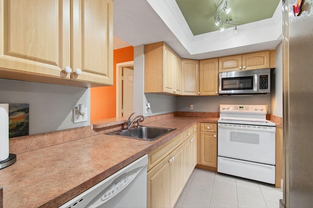 16 Willowbrook Ln Unit 102, Delray Beach, FL 33446 - kitchen with white appliances, light tile patterned flooring, track lighting, ornamental molding, and light brown cabinetry