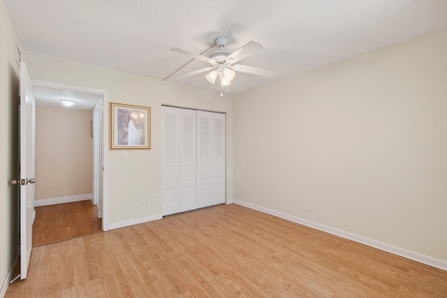 16 Willowbrook Ln Unit 102, Delray Beach, FL 33446 - unfurnished bedroom featuring light wood finished floors, a closet, and ceiling fan