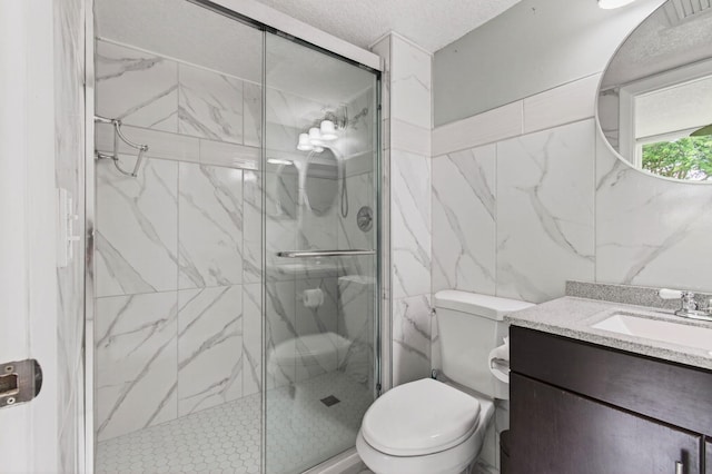 16 Willowbrook Ln Unit 102, Delray Beach, FL 33446 - bathroom featuring vanity, a marble finish shower, tile walls, and a textured ceiling