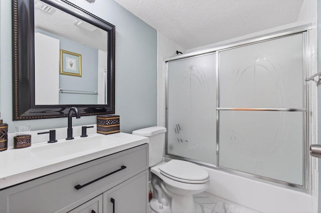 16 Willowbrook Ln Unit 102, Delray Beach, FL 33446 - bathroom with vanity, enclosed tub / shower combo, a textured ceiling, and marble look tile flooring