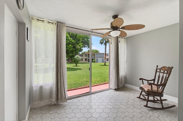 16 Willowbrook Ln Unit 102, Delray Beach, FL 33446 - living area featuring baseboards and ceiling fan