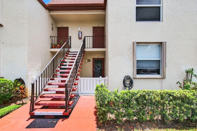 16 Willowbrook Ln Unit 102, Delray Beach, FL 33446 - property entrance with stucco siding