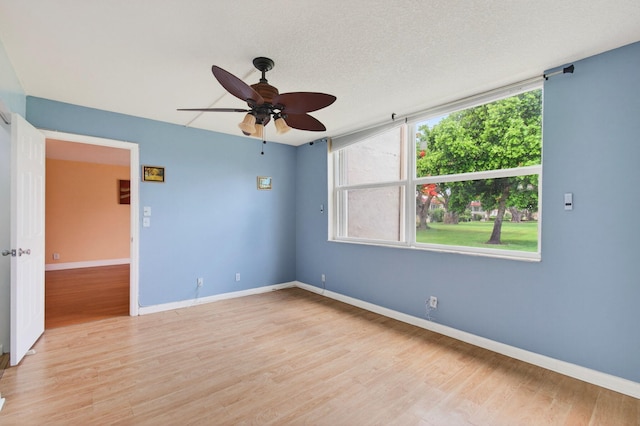 16 Willowbrook Ln Unit 102, Delray Beach, FL 33446 - empty room with light wood-style flooring and a ceiling fan