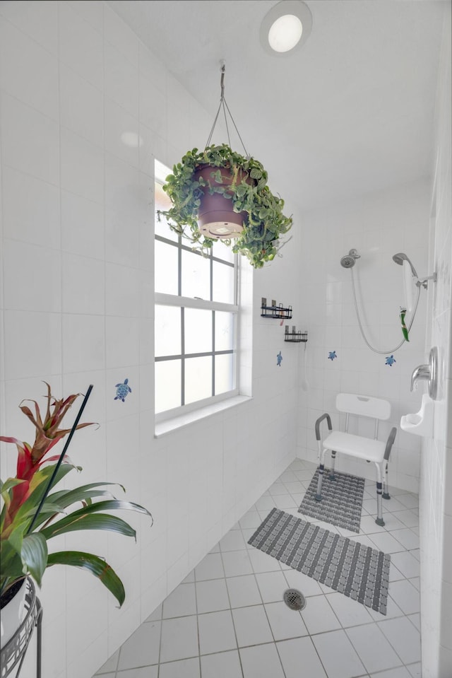 3982 SW Kabane St, Port Saint Lucie, FL 34953 - bathroom featuring a tile shower and tile patterned floors