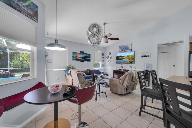 3982 SW Kabane St, Port Saint Lucie, FL 34953 - living room with light tile patterned flooring, lofted ceiling, and a ceiling fan