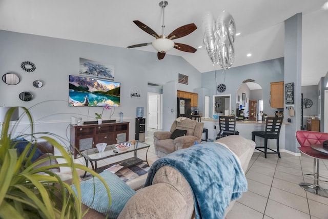 3982 SW Kabane St, Port Saint Lucie, FL 34953 - living area with ceiling fan, light tile patterned flooring, arched walkways, and high vaulted ceiling