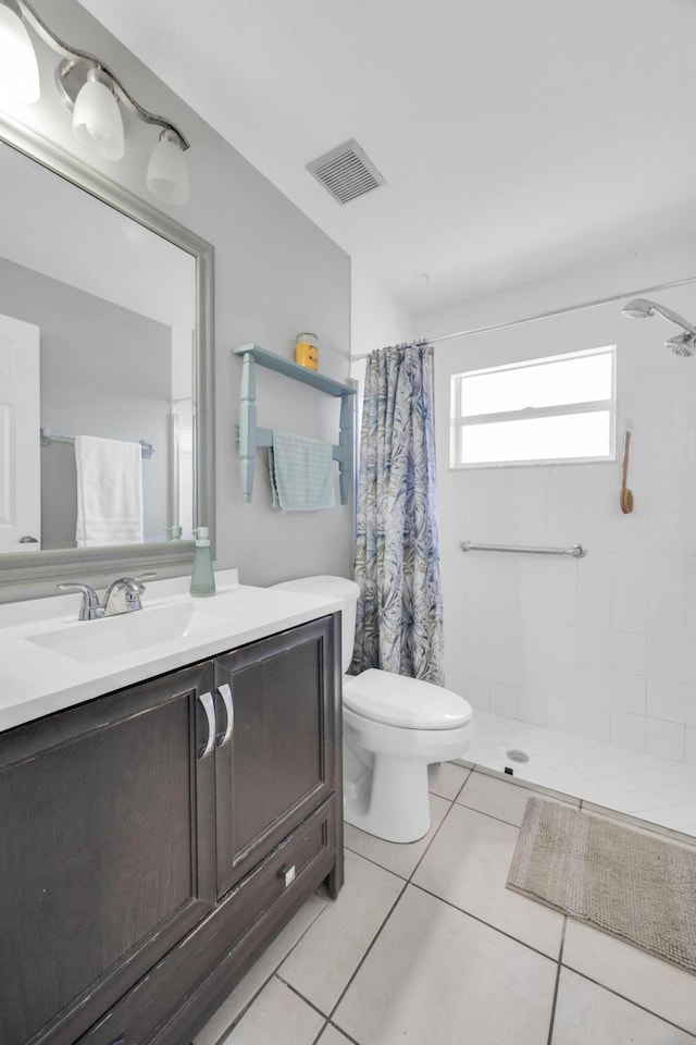 3982 SW Kabane St, Port Saint Lucie, FL 34953 - bathroom featuring vanity, tiled shower, and tile patterned flooring