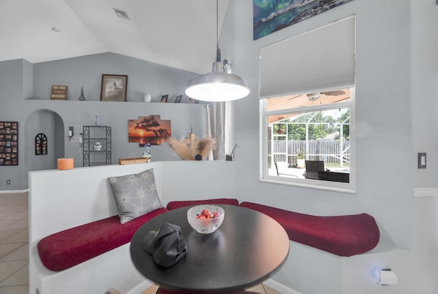 3982 SW Kabane St, Port Saint Lucie, FL 34953 - tiled dining space featuring vaulted ceiling and baseboards