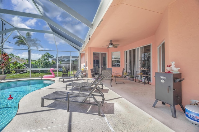 3982 SW Kabane St, Port Saint Lucie, FL 34953 - outdoor pool with a patio, ceiling fan, and glass enclosure