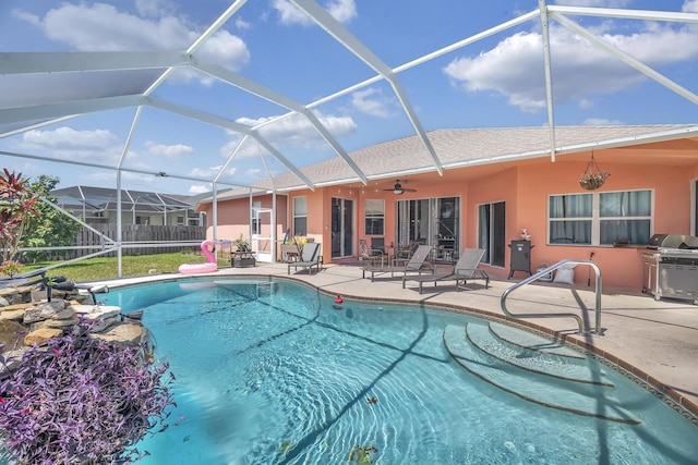 3982 SW Kabane St, Port Saint Lucie, FL 34953 - outdoor pool featuring a patio, ceiling fan, a lanai, and area for grilling