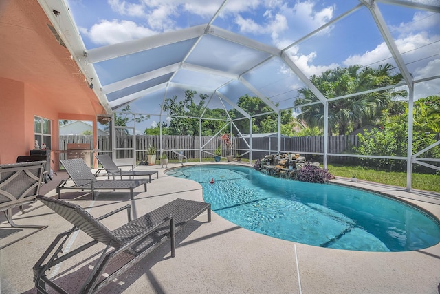 3982 SW Kabane St, Port Saint Lucie, FL 34953 - view of swimming pool with a fenced backyard, a patio, and a lanai