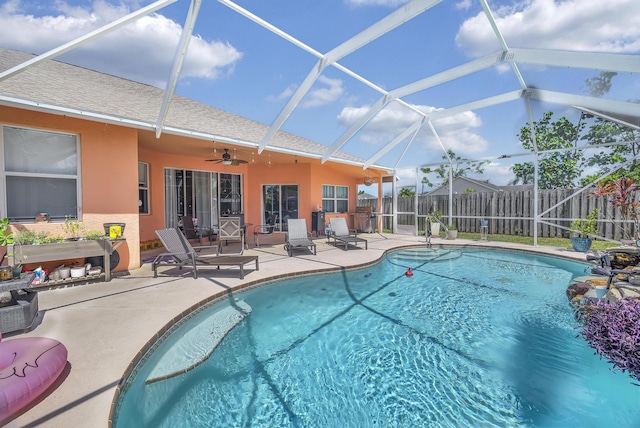 3982 SW Kabane St, Port Saint Lucie, FL 34953 - view of pool featuring a patio, ceiling fan, and glass enclosure