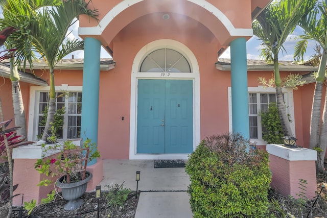 3982 SW Kabane St, Port Saint Lucie, FL 34953 - property entrance featuring stucco siding