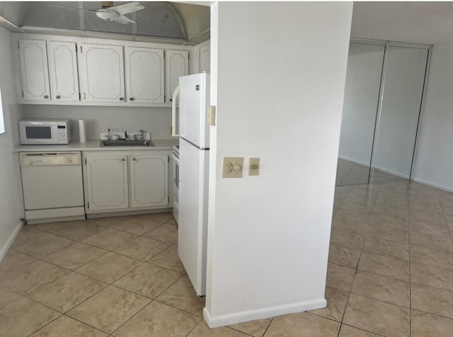 495 Fanshaw L Unit 495, Boca Raton, FL 33434 - kitchen with white appliances, light countertops, light tile patterned floors, and white cabinets