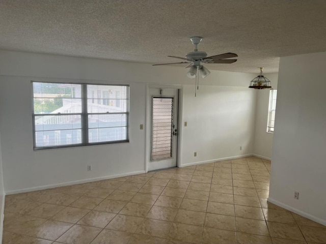 495 Fanshaw L Unit 495, Boca Raton, FL 33434 - spare room featuring tile patterned flooring, a ceiling fan, and a textured ceiling