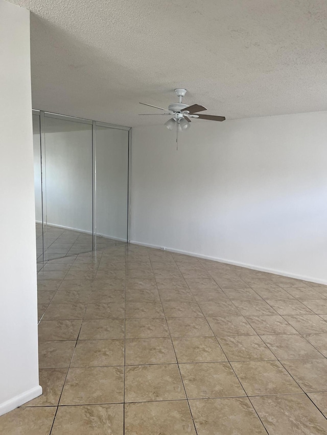 495 Fanshaw L Unit 495, Boca Raton, FL 33434 - empty room featuring ceiling fan and a textured ceiling