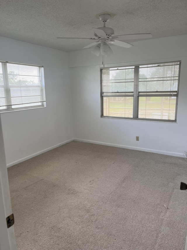 495 Fanshaw L Unit 495, Boca Raton, FL 33434 - carpeted empty room with ceiling fan and a textured ceiling