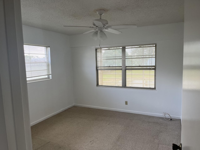 495 Fanshaw L Unit 495, Boca Raton, FL 33434 - carpeted empty room with a textured ceiling and ceiling fan