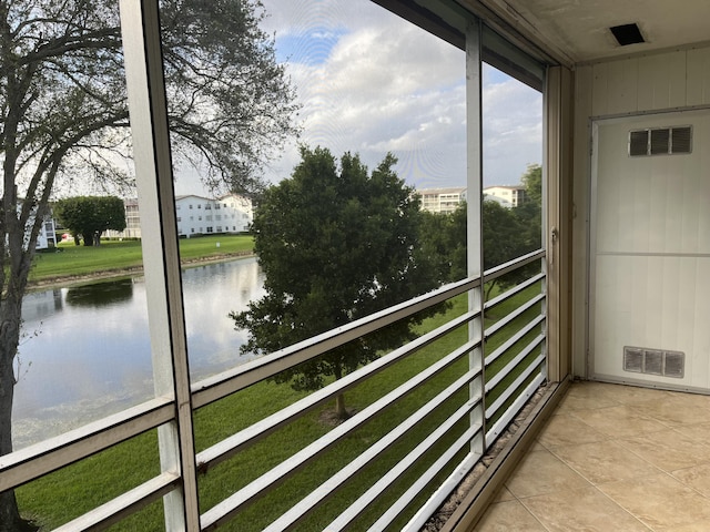 495 Fanshaw L Unit 495, Boca Raton, FL 33434 - unfurnished sunroom with a water view and plenty of natural light