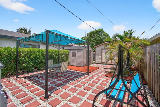 406 N D St, Lake Worth Beach, FL 33460 - fenced backyard with a storage shed and a patio