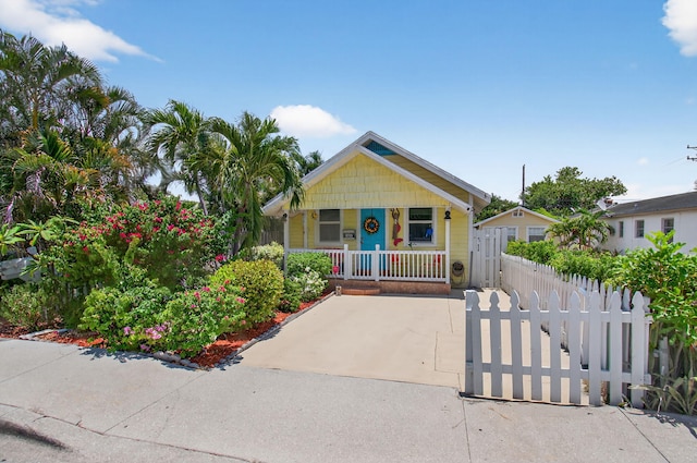406 N D St, Lake Worth Beach, FL 33460 - bungalow featuring covered porch