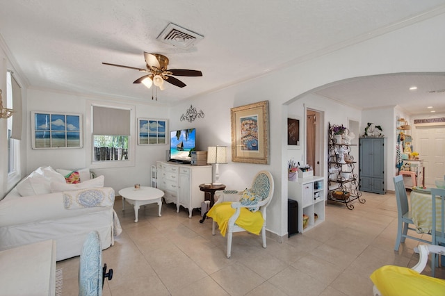 406 N D St, Lake Worth Beach, FL 33460 - living area featuring arched walkways, ornamental molding, ceiling fan, light tile patterned flooring, and recessed lighting